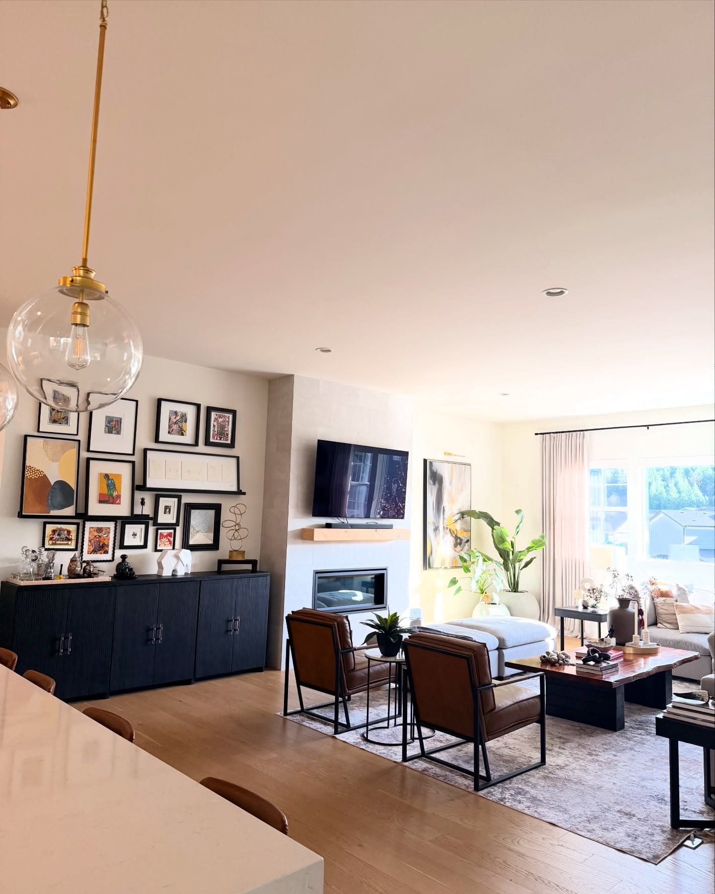 Warm, open-concept living and dining space designed by Casa Loom